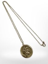 A 9ct yellow gold St Christopher disc pendant on 9ct gold chain CONDITION REPORT: 7.