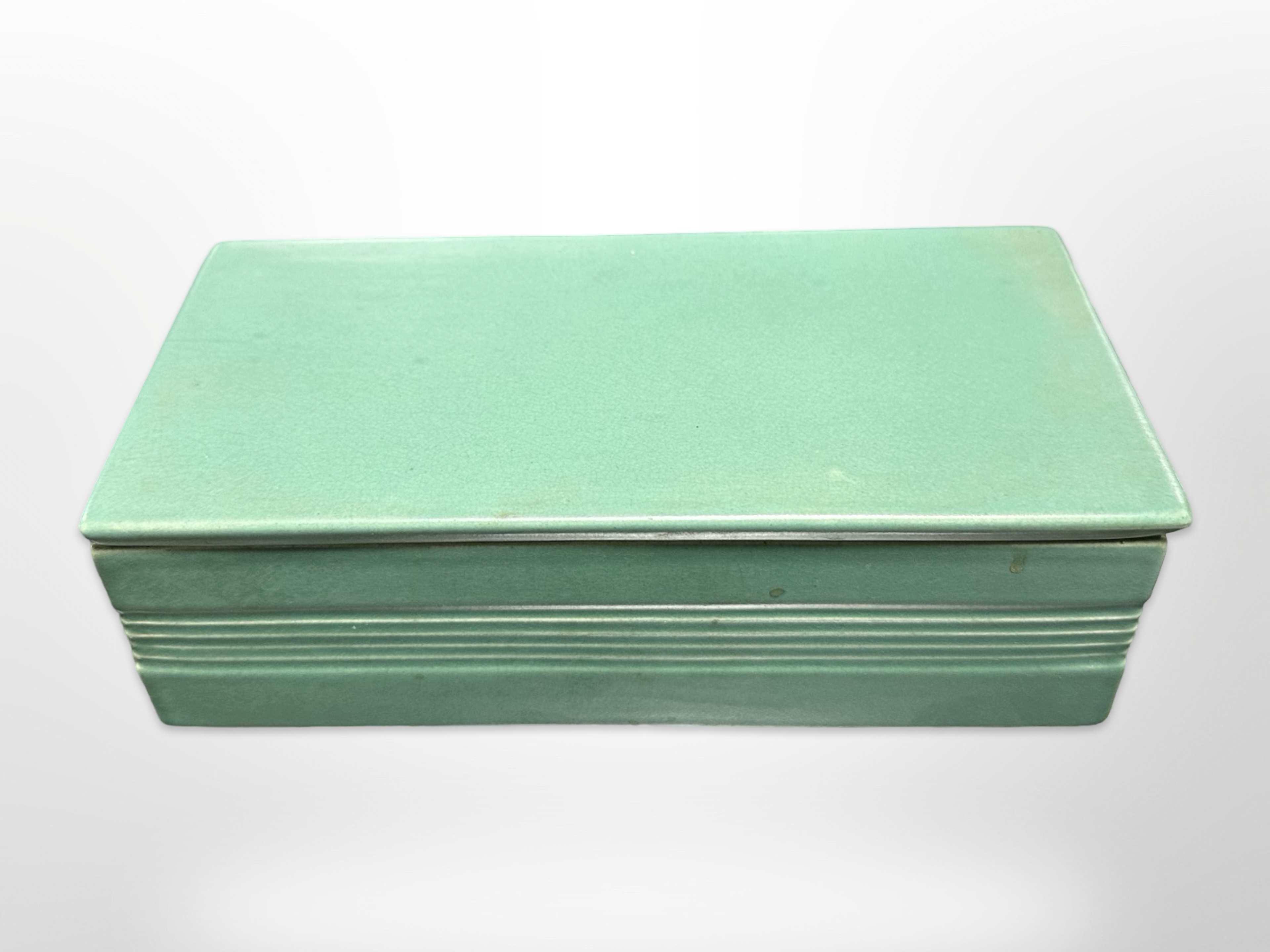 A Keith Murray for Wedgwood green-glazed rectangular lidded trinket box, width 19cm.