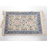 A Tunisian woolen rug on cream ground,