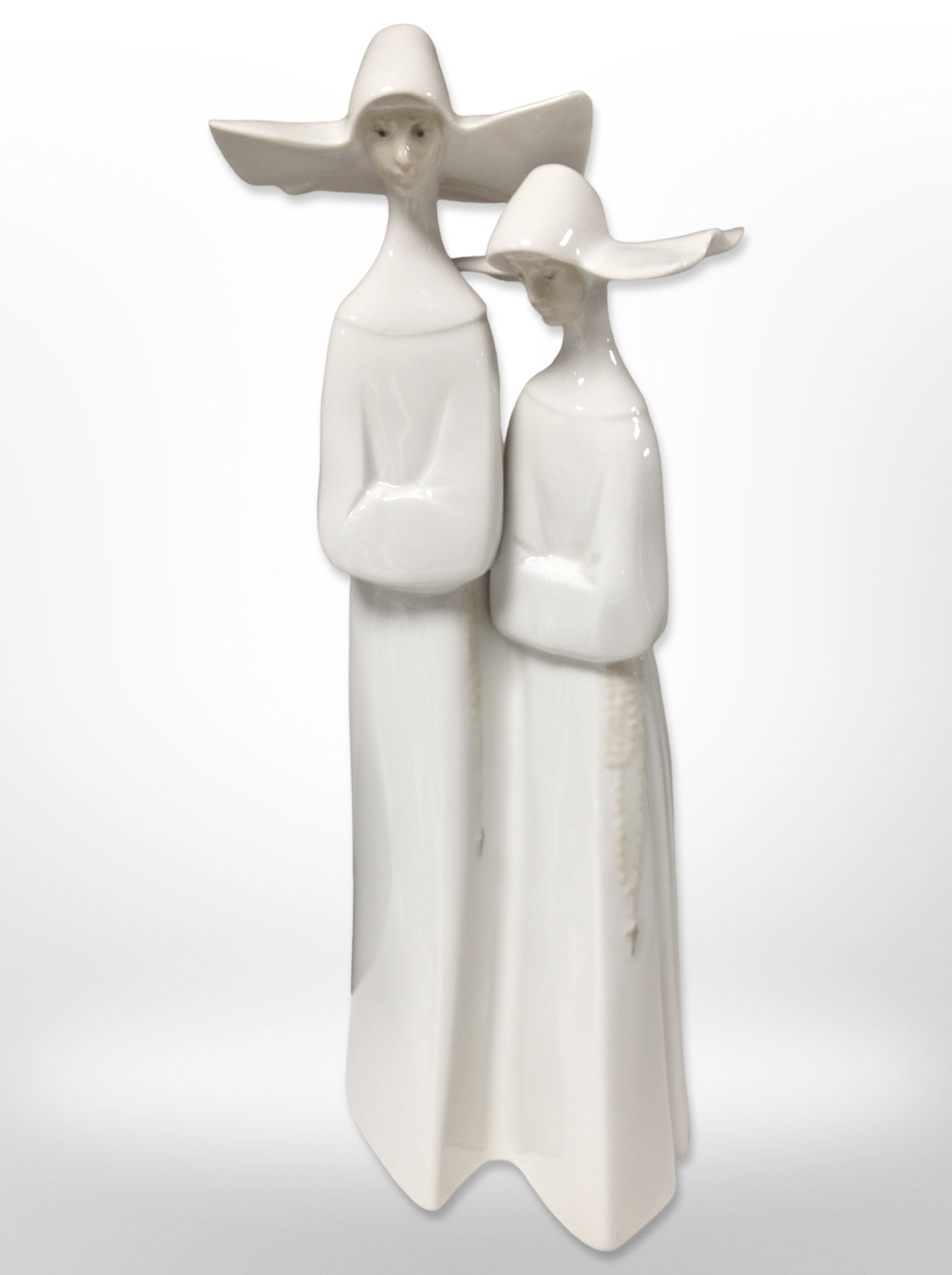 A Lladró figure of two nuns, height 32cm.