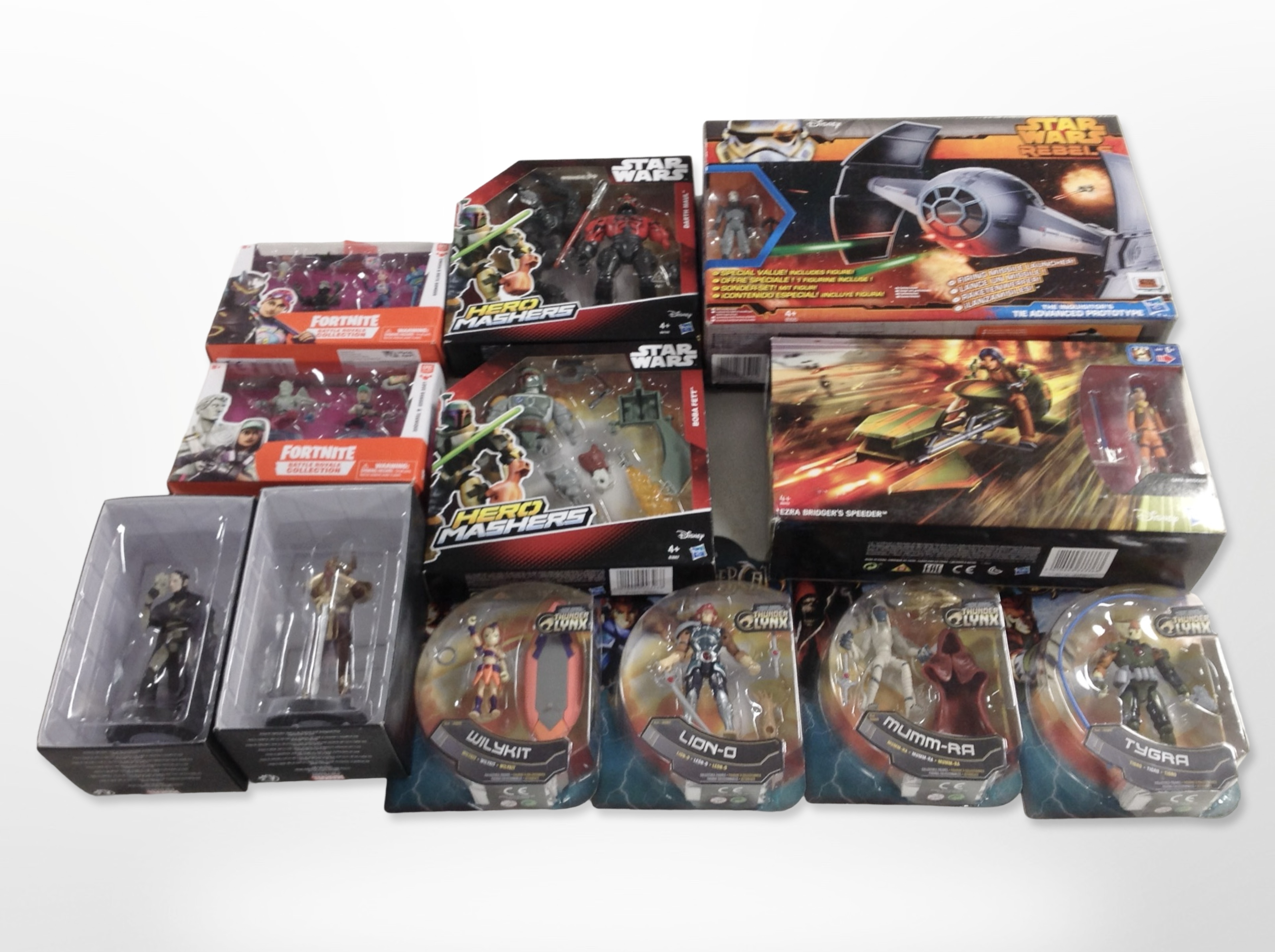 11 Bandai, Epic Games and Hasbro figurines including Star Wars, Thundercats, Fornite, etc., boxed.