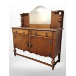 A 1920's oak mirror backed sideboard,