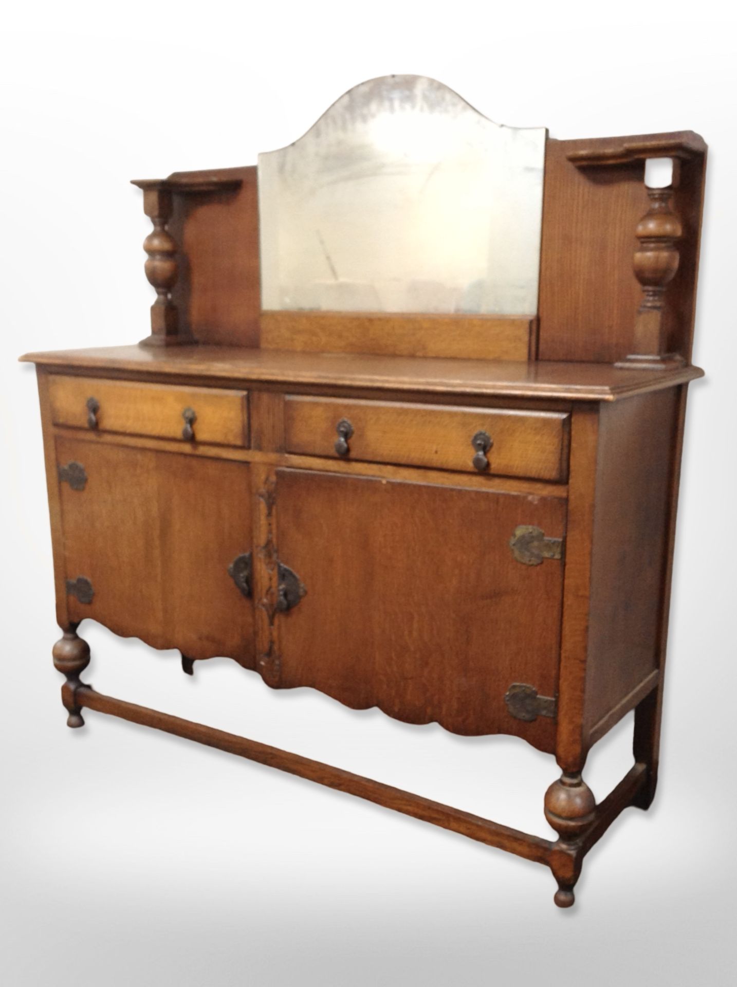 A 1920's oak mirror backed sideboard,