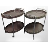 A pair of late 20th century Scandinavian plastic and chrome oval serving trolleys on castors,