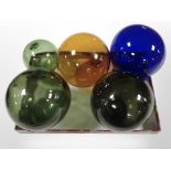 Five vintage glass fishing floats in various colours