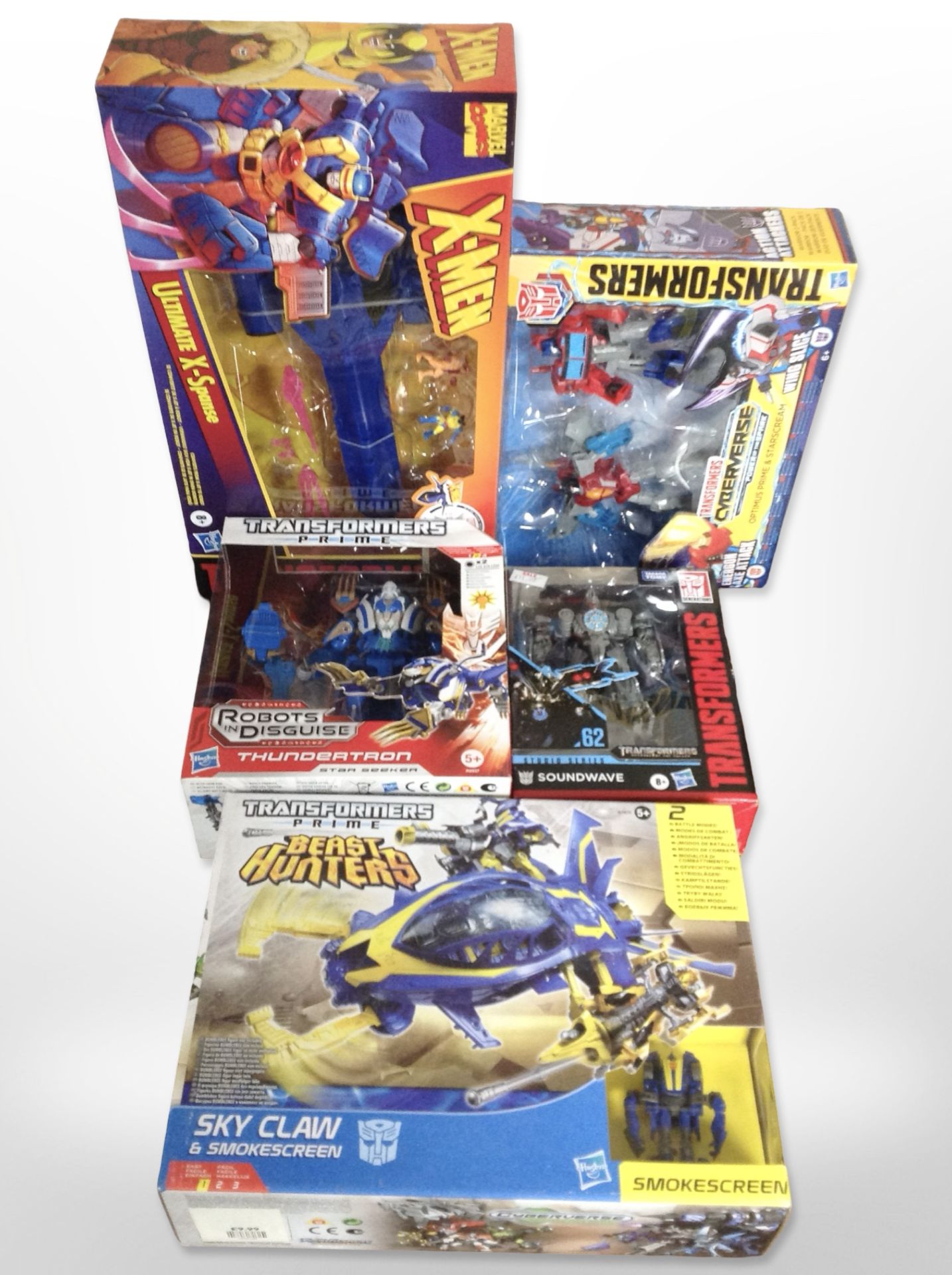 Five Hasbro Transformers figurines, boxed.