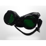 A pair of BOC green-tinted flight goggles.