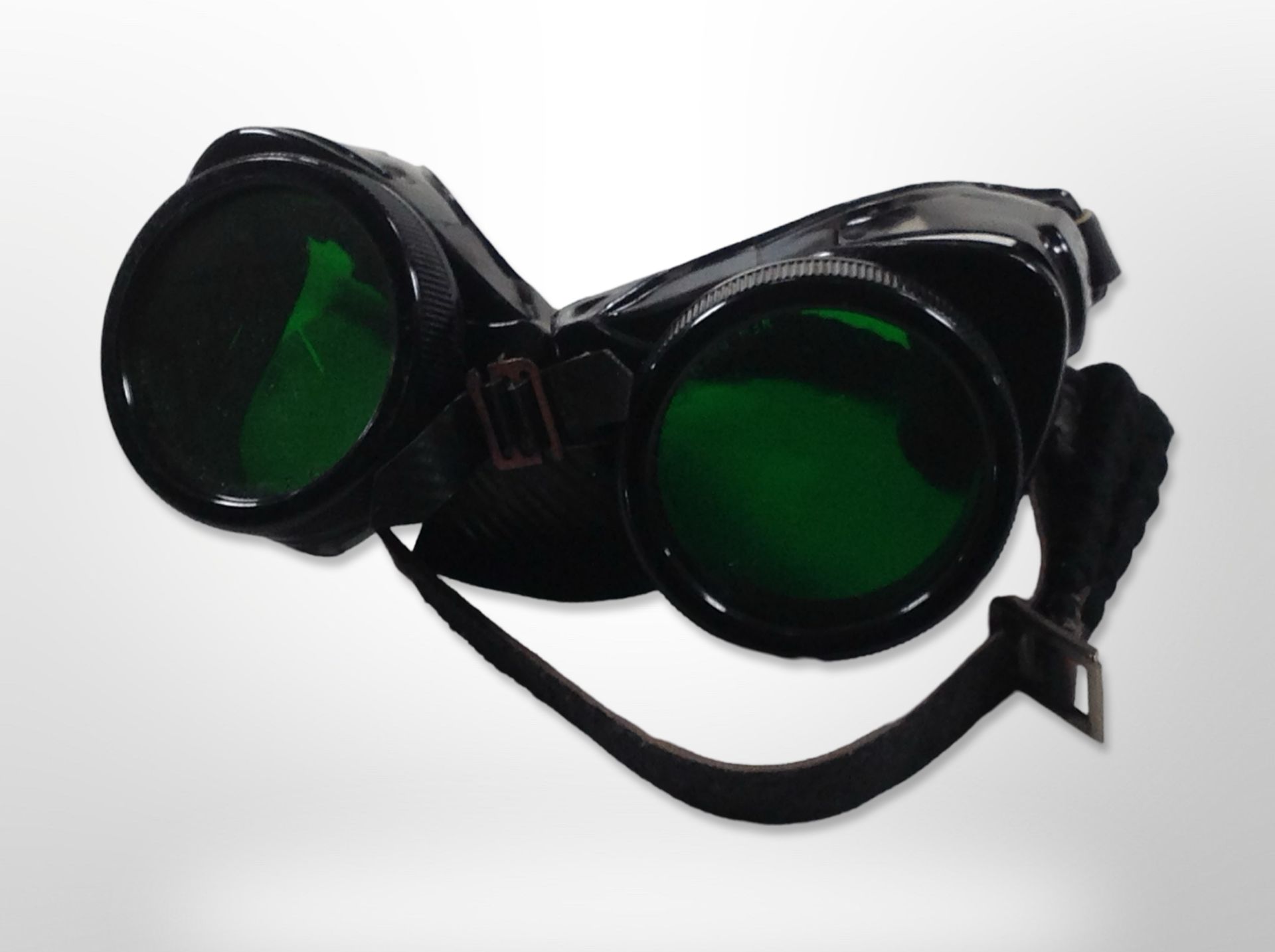 A pair of BOC green-tinted flight goggles.