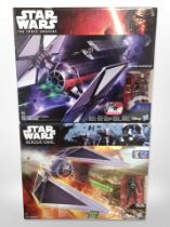 Two Hasbro Disney Star Wars models, Tie Striker and Tie Fighter, boxed.