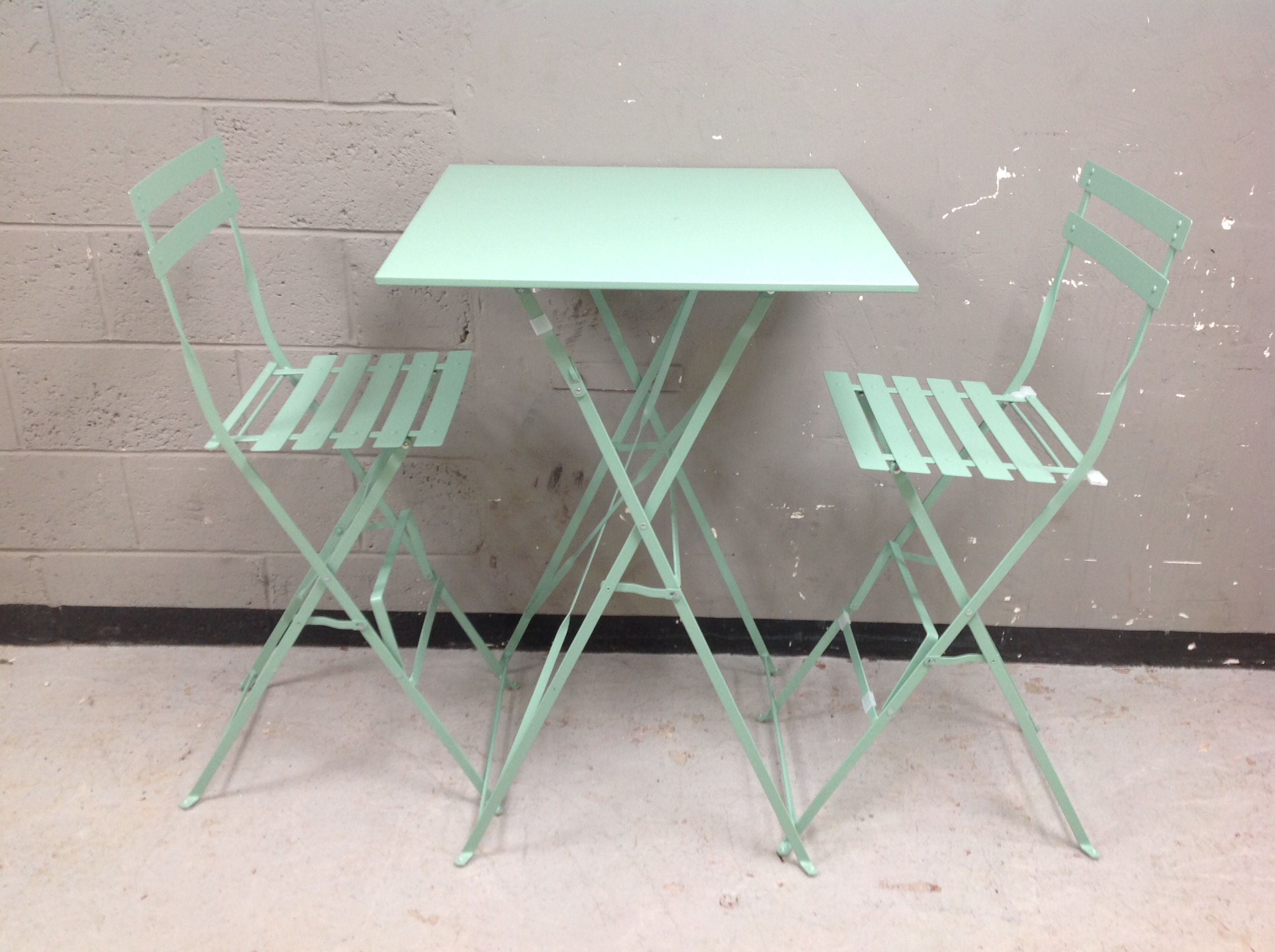 A contemporary painted metal folding garden table,