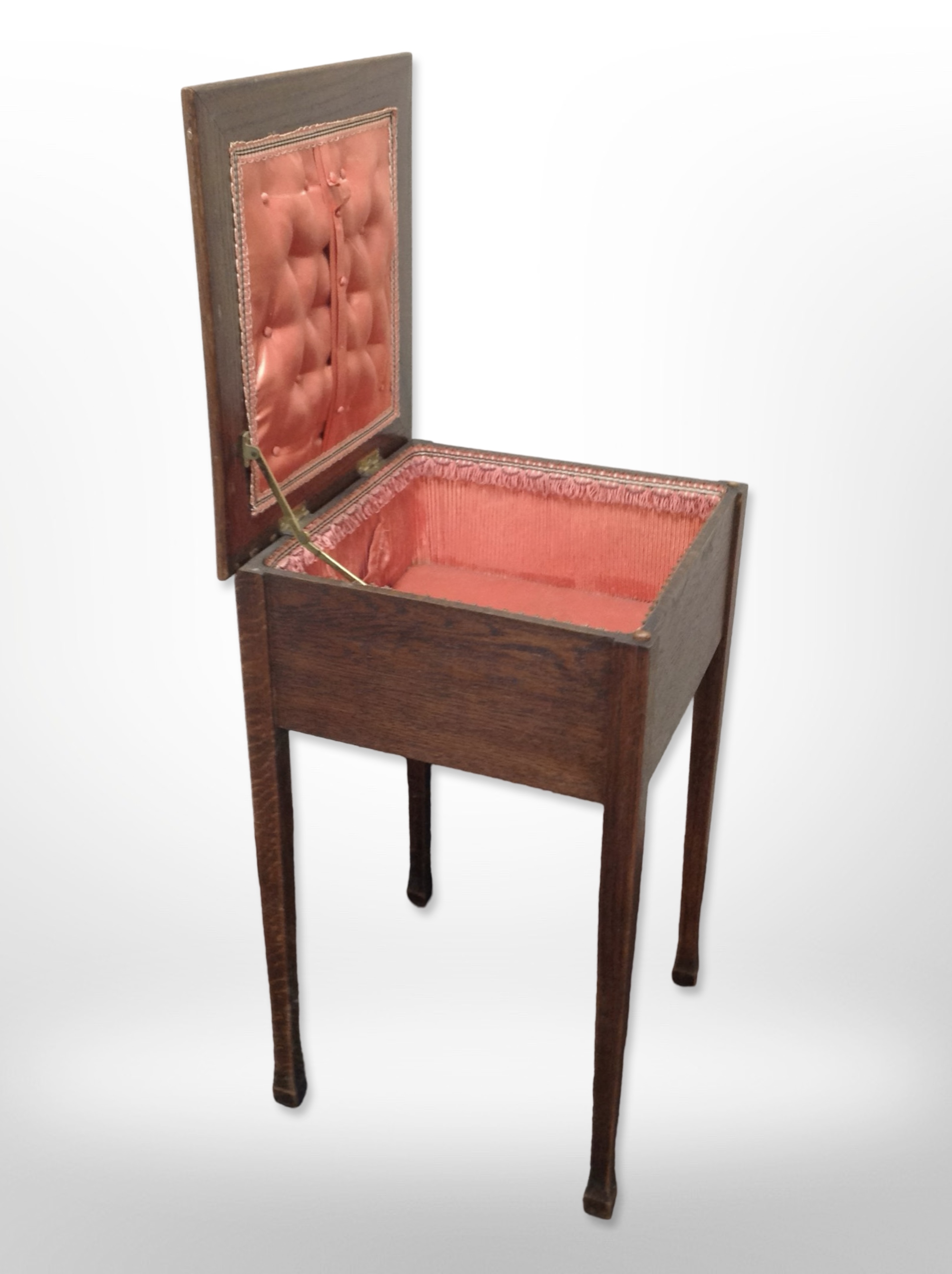 An early 20th century oak sewing box,
