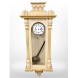 A painted Vienna-style wall clock with enamelled dial, height 120cm, with pendulum.