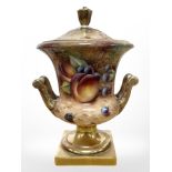 A Royal Worcester campana-shape lidded twin-handled urn, hand painted with fruit,