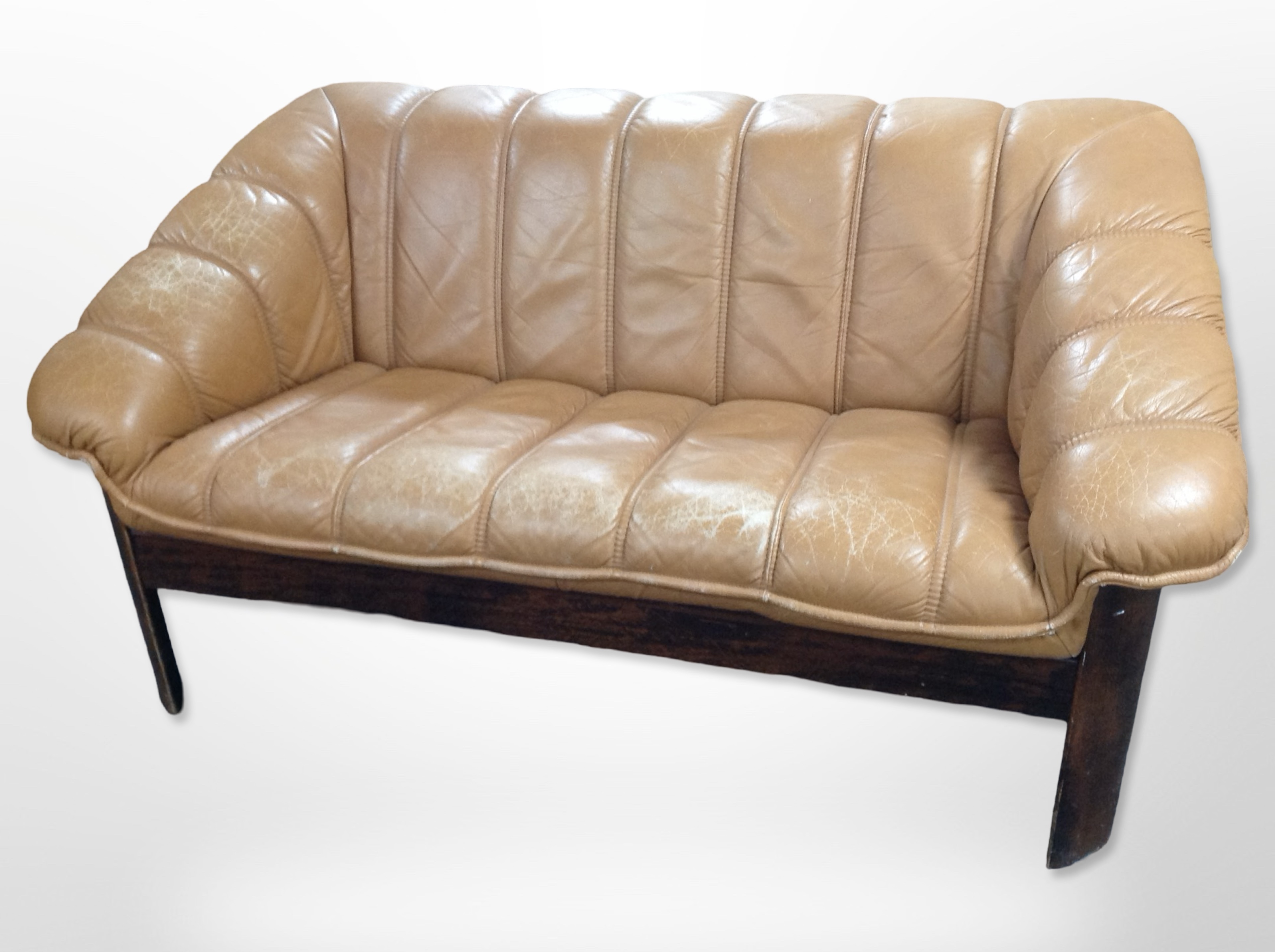 A 20th-century Danish stained wood-framed tan leather two-seater settee,