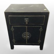 A contemporary Japanese-style lacquered and gilt low cabinet, 44cm wide x 32cm deep x 55cm high.