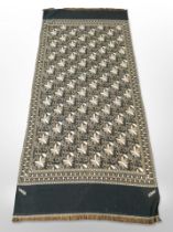 A decorative hand-stitched throw by Rosetex, 226cm x 99cm.