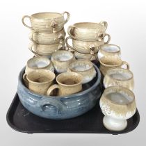 A group of glazed stoneware twin-handled bowls, goblets, shallow dish, etc.