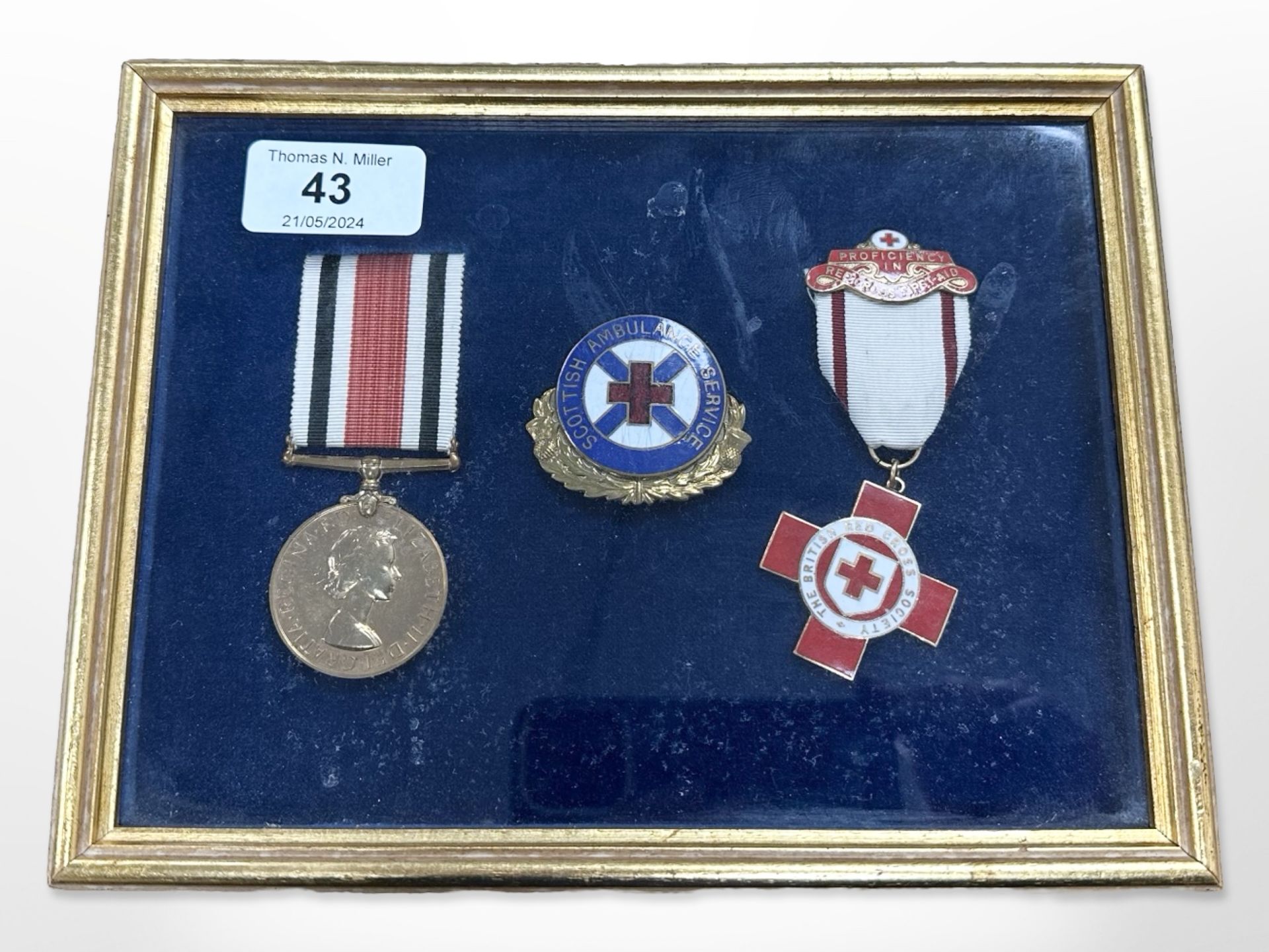 A framed medal montage 'Scottish Ambulance Service'