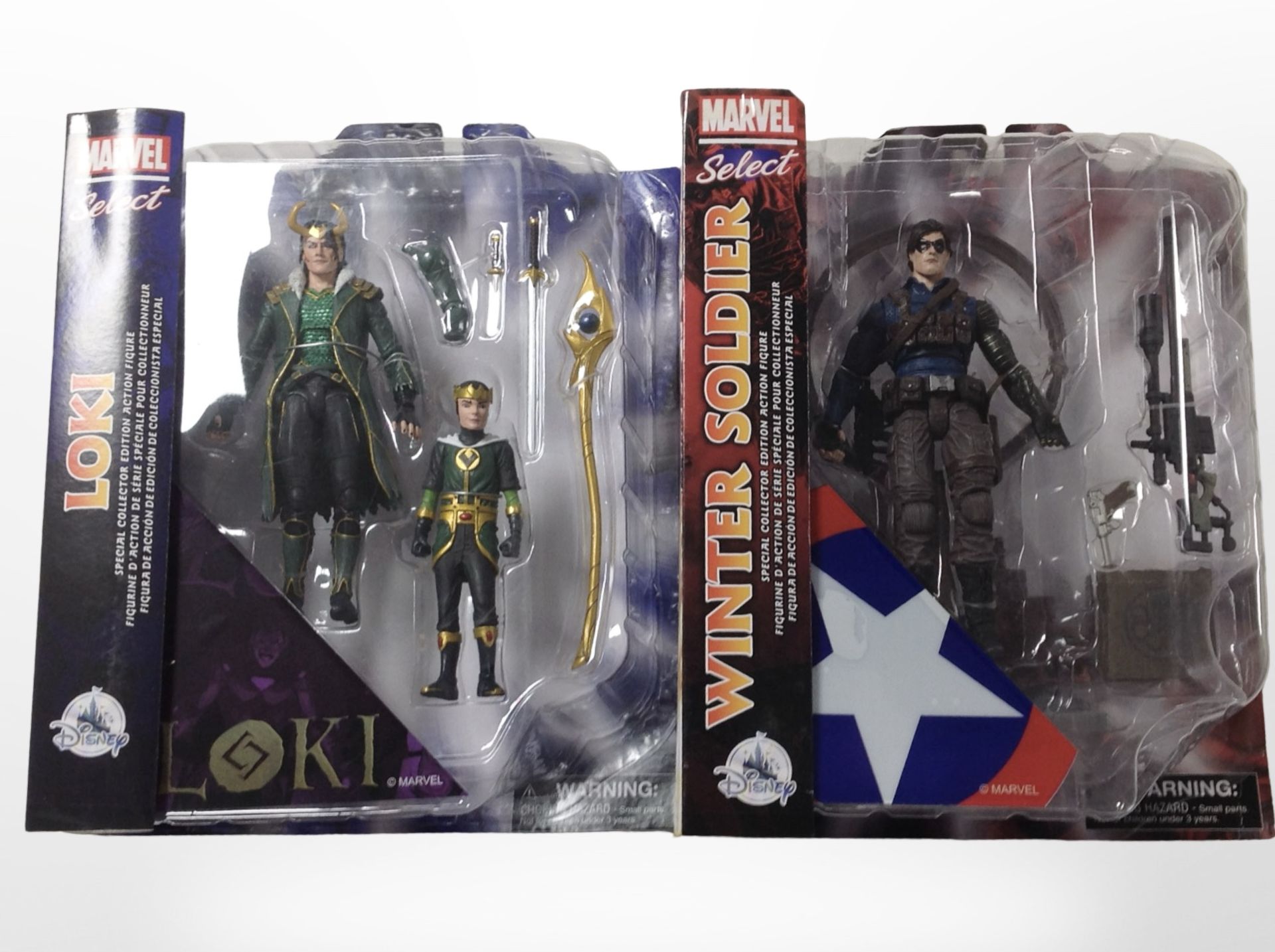 Two Marvel Select figurines, Loki and the Winter Soldier, boxed.