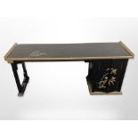 An oriental lacquered and gilt low table, 99cm wide x 30cm deep, 39cm high.