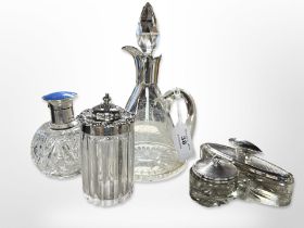 A cut crystal dressing table flask with silver and enamel top, further crystal jar with silver lid,
