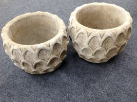 A pair of concrete "pineapple" garden planters,