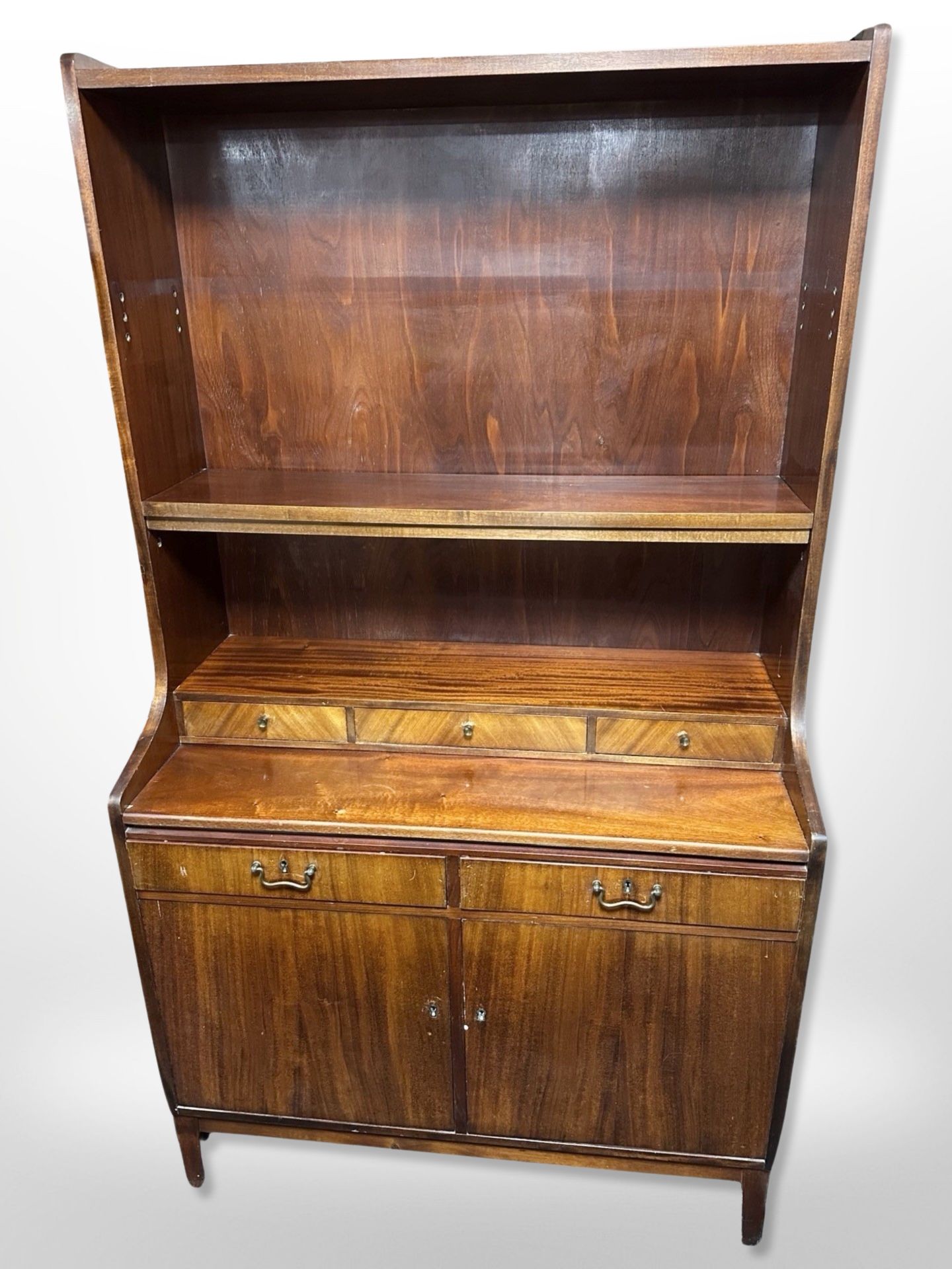 A Danish stained teak and pine open bookcase, fitted cupboards beneath,