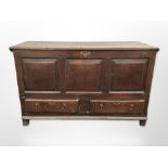 A George III panelled oak mule chest, 150cm wide x 59cm deep x 91cm high.