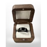 A gent's black titanium ring,