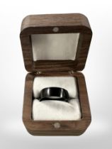 A gent's black titanium ring,