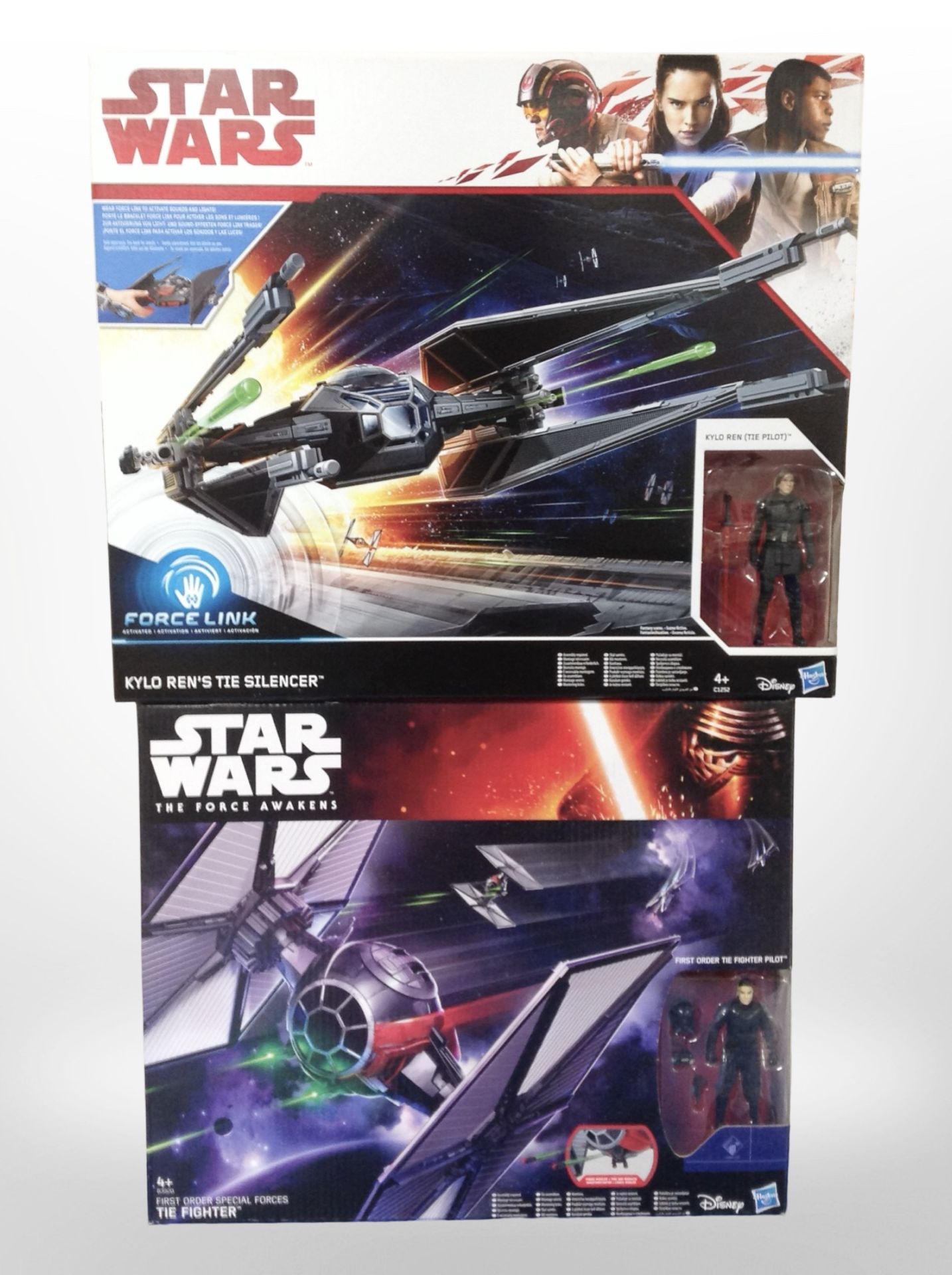 Three Hasbro Disney Star Wars figures, Tie Fighter and Kylo Ren's Tie Silencer, boxed.