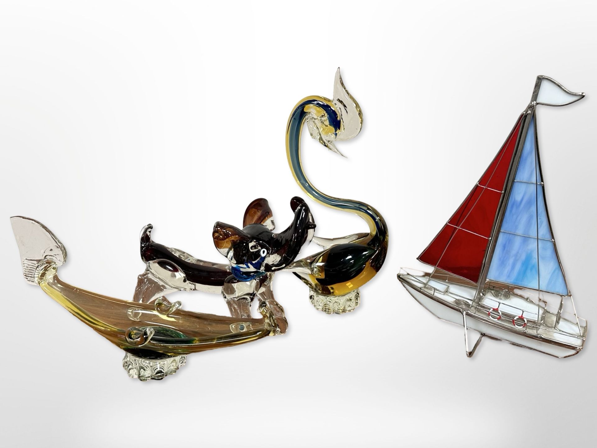 A collection of contemporary glass animal ornaments to include Murano dog, sailing boat ornament,