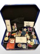 A group of Masonic medals, silver and enamelled medal on ribbon in case etc.