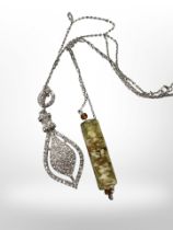 An encrusted pendant on silver chain,