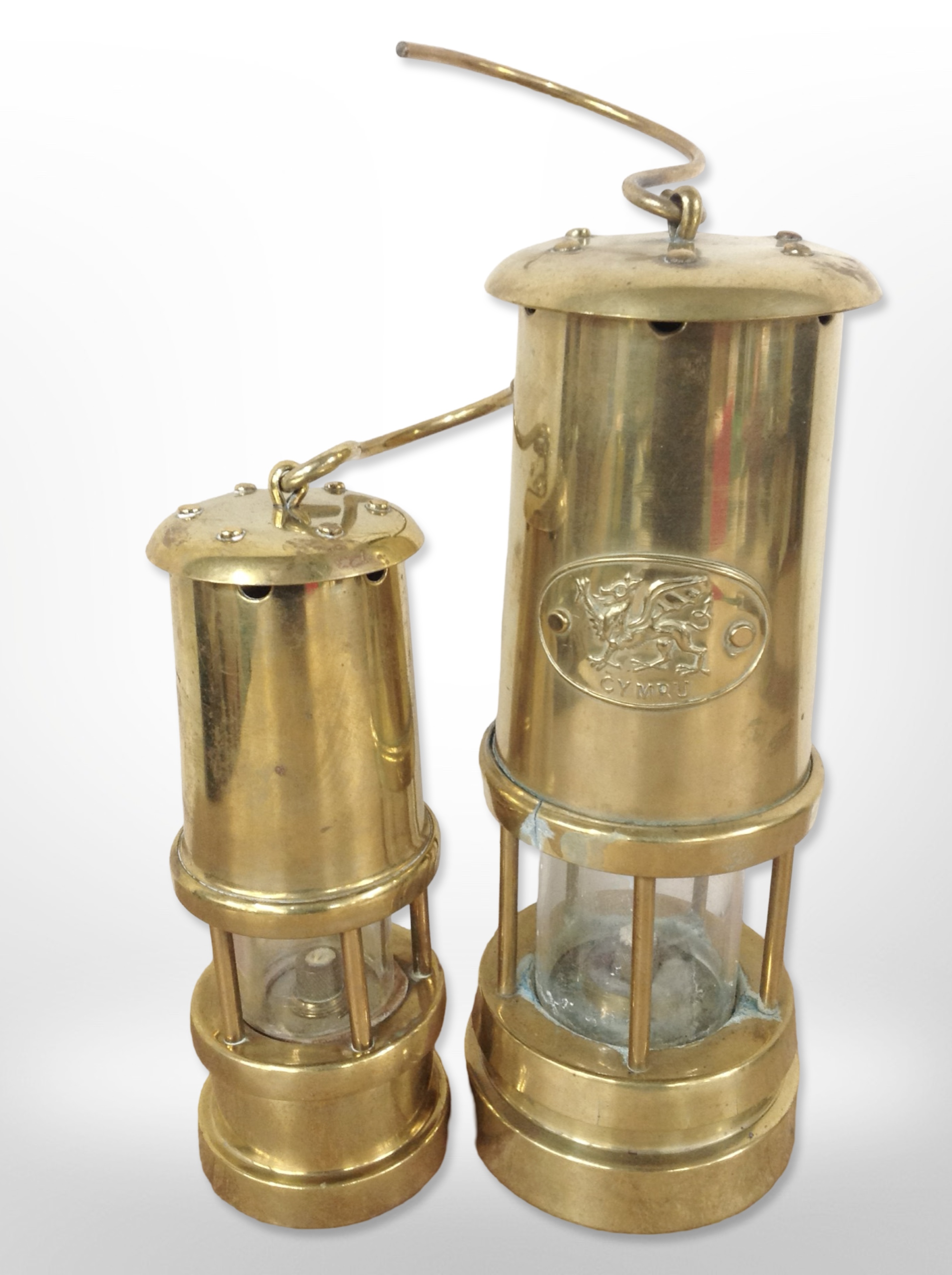 A Welsh brass miner's lamp, plus another smaller.