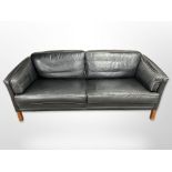 A late 20th-century Danish black leather two-seater settee, length 195cm x depth 80cm x 72cm.