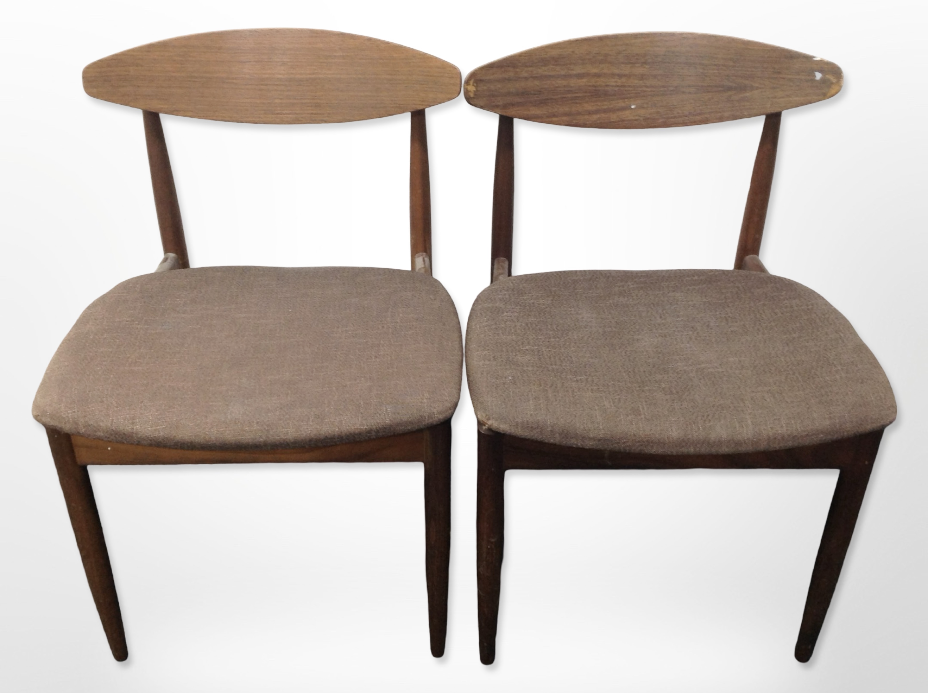 A pair of 20th-century G Plan teak-framed dining chairs in dark brown upholstery.