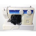 A Homedream electric sewing machine with lead and pedal.