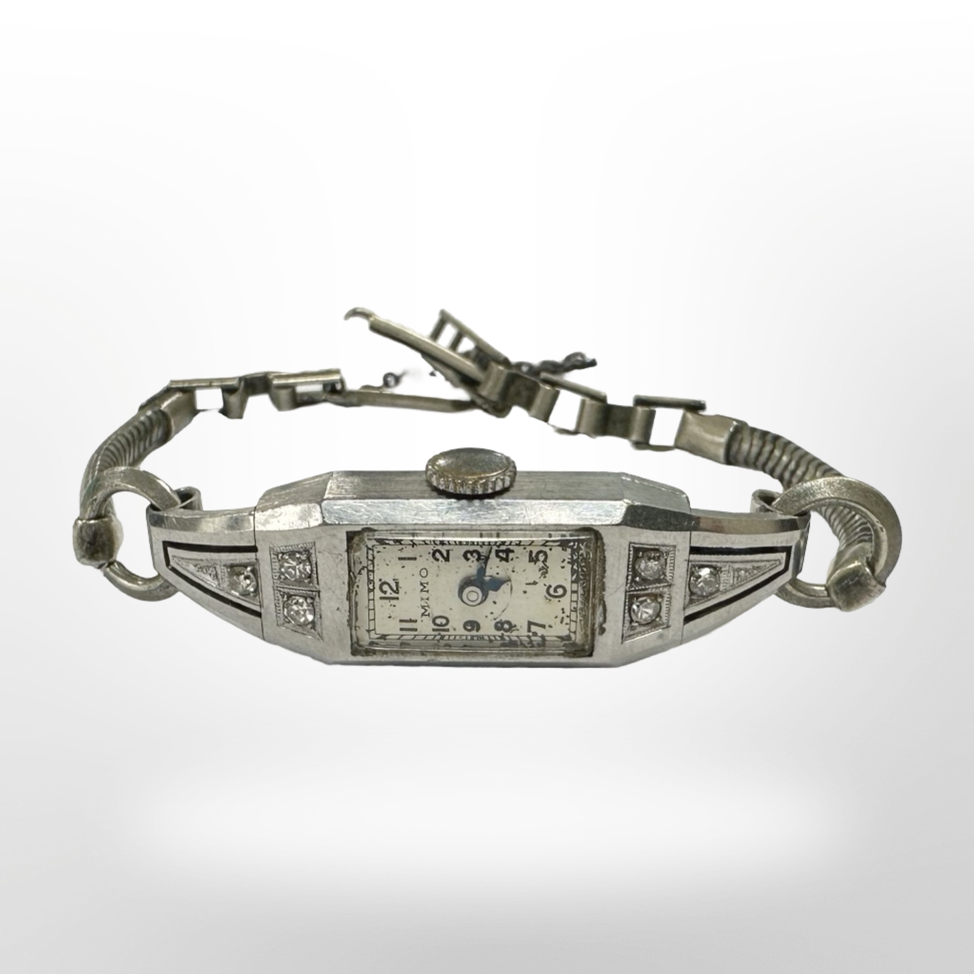 An Art Deco lady's cocktail watch set with six diamonds,