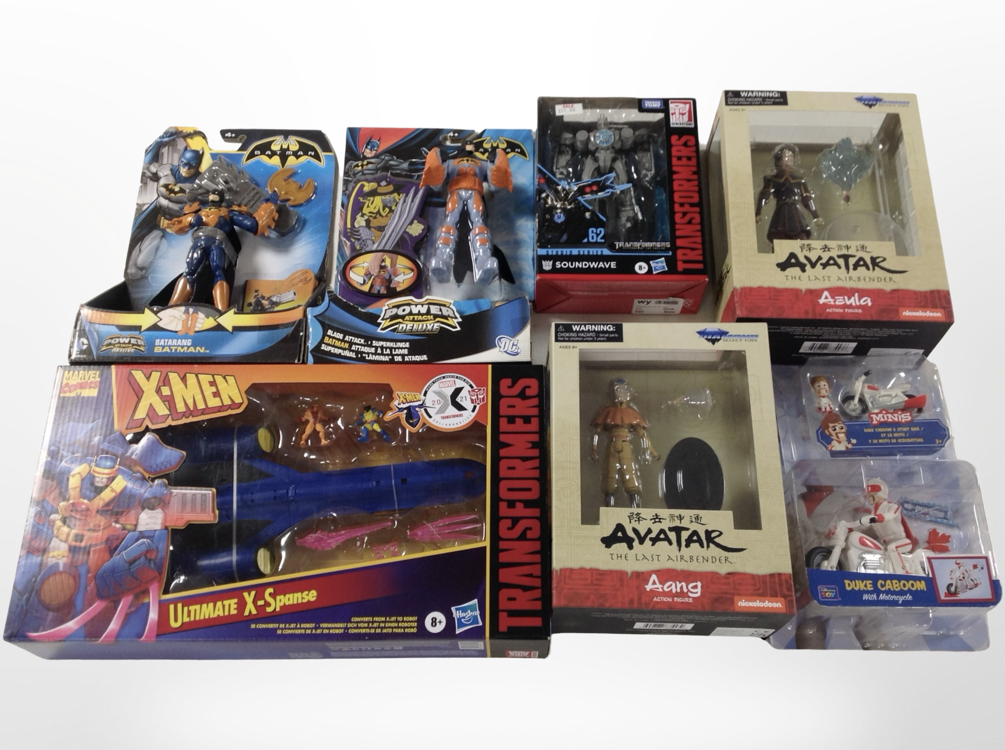 Eight Hasbro, Diamond and other figurines including Transformers, X-Men, Avatar, Batman, etc.