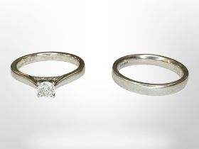 A platinum diamond solitaire ring, 0.