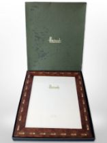 An inlaid photograph frame retailed by Harrods, 31cm x 26cm.