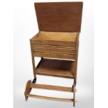 An oak two-tier serving trolley with pull-out cutlery drawer, width 57cm,