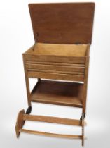 An oak two-tier serving trolley with pull-out cutlery drawer, width 57cm,