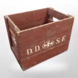 A painted pine bottle crate bearing advertising, width 48cm.