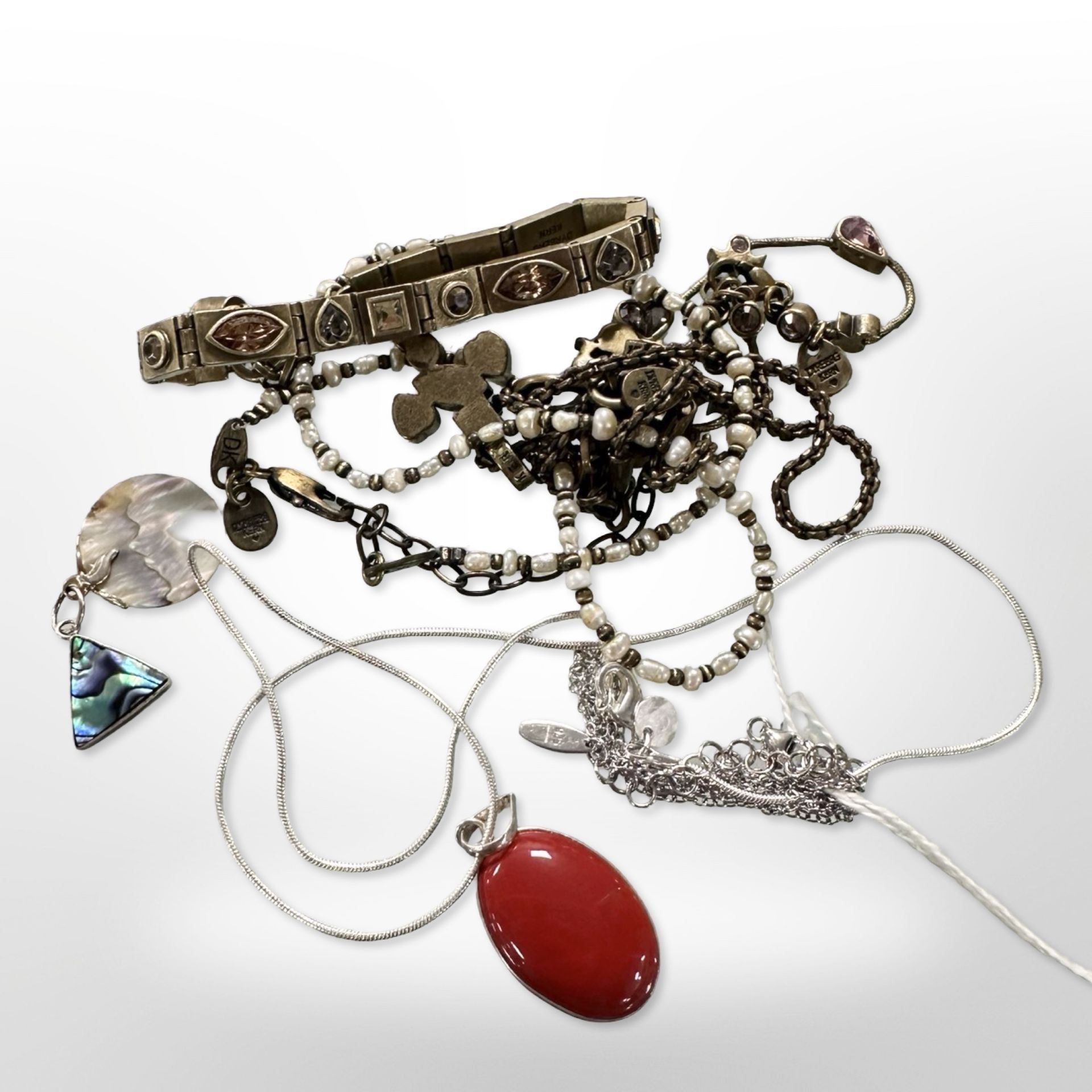 Two Dyrberg Kern bronze bracelets, two necklaces,