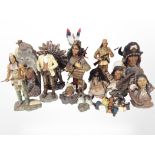 A collection of Native American and cowboy ornaments including Leonardo Collection.