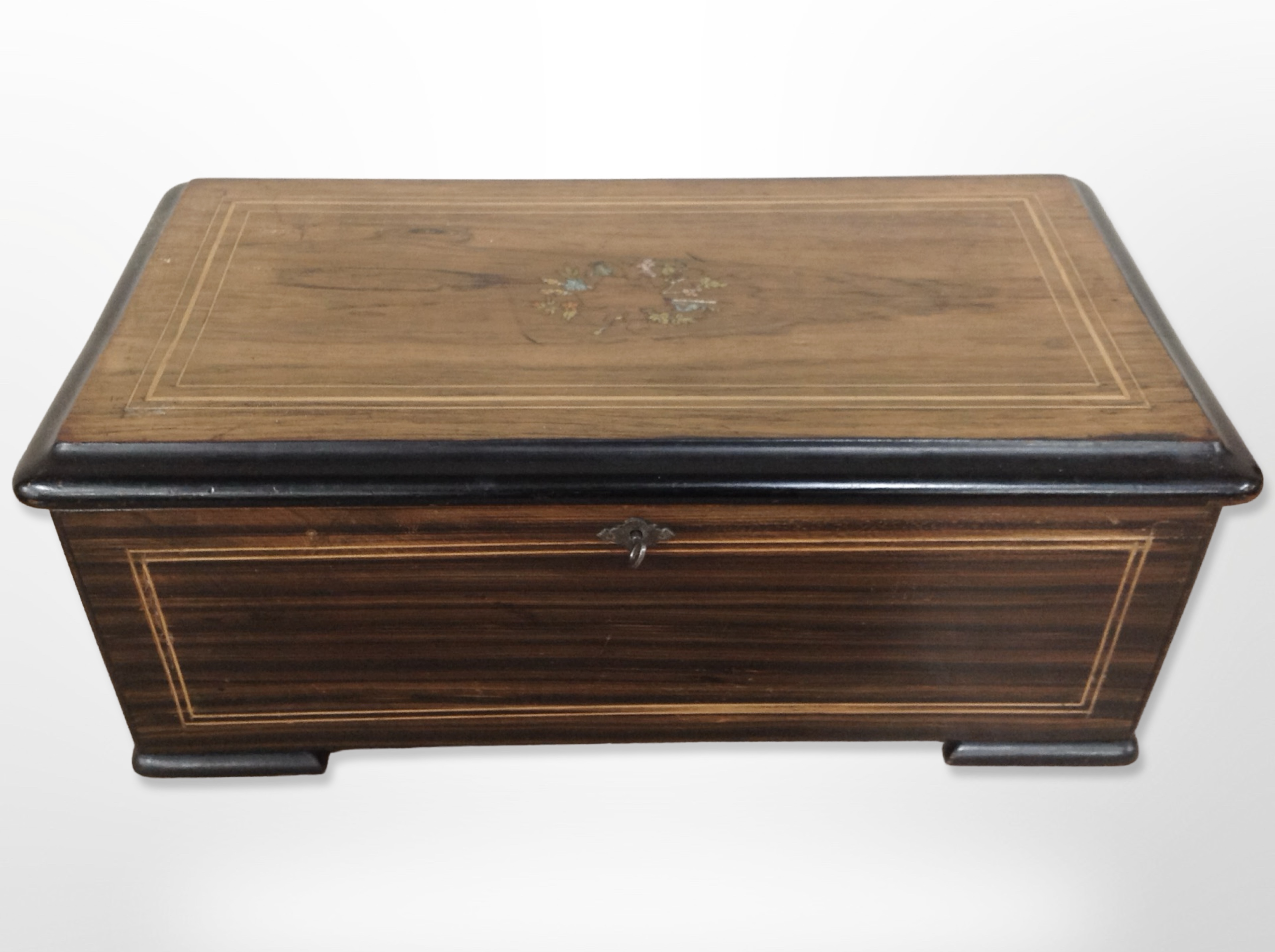 A 19th-century Swiss rosewood and satinwood strung cylinder music box playing 12 airs, width 48cm.