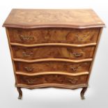 A reproduction yew wood serpentine four-drawer chest, 75cm wide x 37cm deep x 91cm high.