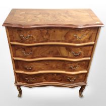 A reproduction yew wood serpentine four-drawer chest, 75cm wide x 37cm deep x 91cm high.